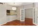 Living room with hardwood floors and a view of kitchen at 1130 Piedmont Ne Ave # 410, Atlanta, GA 30309