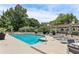 Resort-style pool surrounded by lush landscaping, lounge chairs, and umbrellas for ultimate relaxation at 1130 Piedmont Ne Ave # 410, Atlanta, GA 30309