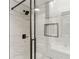 Modern shower design with glass enclosure, rain shower head, sleek fixtures, and built-in niche at 1130 Piedmont Ne Ave # 410, Atlanta, GA 30309