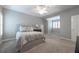 Bedroom with a light gray color scheme, carpet flooring, and natural lighting from the windows at 185 Windsor Cv, Sandy Springs, GA 30328