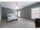 Bedroom with comfortable area to rest or read, natural light, and room to grow at 185 Windsor Cv, Sandy Springs, GA 30328