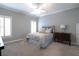 Bedroom with neutral color scheme, carpet flooring, and natural light from large windows at 185 Windsor Cv, Sandy Springs, GA 30328