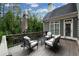 Inviting outdoor deck with stylish seating and an umbrella for comfortable lounging at 185 Windsor Cv, Sandy Springs, GA 30328