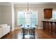 Open dining area featuring modern light fixtures and hardwood floors at 185 Windsor Cv, Sandy Springs, GA 30328