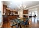 Kitchen dining area adjacent to the kitchen with custom wood cabinets at 185 Windsor Cv, Sandy Springs, GA 30328