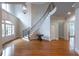 Stunning foyer with winding staircase, hardwood floors, high ceilings, and elegant chandelier at 185 Windsor Cv, Sandy Springs, GA 30328