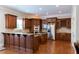 Large kitchen with custom wood cabinets, granite countertops and stainless steel appliances at 185 Windsor Cv, Sandy Springs, GA 30328