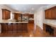 Spacious kitchen featuring custom wood cabinets, granite countertops and stainless appliances at 185 Windsor Cv, Sandy Springs, GA 30328