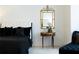 Bedroom showcasing a luxurious bed and decorative mirror at 185 Windsor Cv, Sandy Springs, GA 30328