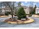 Picturesque neighborhood with landscaped island, benches, and stone walkways at 185 Windsor Cv, Sandy Springs, GA 30328