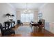 Well-lit office space with hardwood floors, wainscoting, and a large window for natural light at 185 Windsor Cv, Sandy Springs, GA 30328
