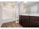 Well-maintained bathroom with a shower-tub and spacious vanity at 1881 Millstream Holw, Conyers, GA 30012