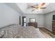 Spacious bedroom featuring tray ceilings, ceiling fan, and wood-look flooring for a modern, inviting ambiance at 2889 Estuary Dr, Acworth, GA 30101