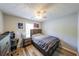 Cozy bedroom featuring a wooden bed frame, a desk, and hardwood floors at 2889 Estuary Dr, Acworth, GA 30101