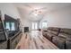 Cozy living room features a fireplace, vaulted ceiling, neutral paint, and lots of natural light at 2889 Estuary Dr, Acworth, GA 30101