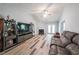 Inviting living room features a fireplace, high ceilings, hardwood floors, and ample natural light at 2889 Estuary Dr, Acworth, GA 30101