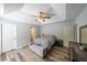 Spacious main bedroom featuring a trey ceiling, hardwood floors, and neutral walls at 2889 Estuary Dr, Acworth, GA 30101