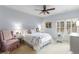 Bedroom featuring neutral carpet, a white bed, and matching furniture at 320 Wisteria Cir, Roswell, GA 30076