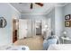 Bedroom with ensuite bathroom access, neutral carpet, and light blue walls at 320 Wisteria Cir, Roswell, GA 30076