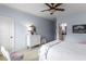 Bright bedroom with neutral carpet, light blue walls, and white trim at 320 Wisteria Cir, Roswell, GA 30076