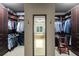 Walk-in closet with custom shelving and ample storage space for clothes and accessories at 320 Wisteria Cir, Roswell, GA 30076