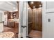 Residential elevator with wood paneling conveniently located adjacent to the kitchen at 320 Wisteria Cir, Roswell, GA 30076
