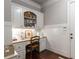 Home office with custom built-ins, granite countertop, and wainscoting offers an elegant workspace at 320 Wisteria Cir, Roswell, GA 30076