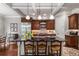 Modern kitchen with stainless steel refrigerator, center island and coffered ceilings at 320 Wisteria Cir, Roswell, GA 30076