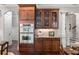 Gourmet kitchen showcasing double ovens, custom cabinetry, and elegant finishes at 320 Wisteria Cir, Roswell, GA 30076