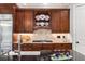 Close-up of the kitchen with stainless steel appliances and designer tile backsplash at 320 Wisteria Cir, Roswell, GA 30076