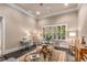 Cozy living room with light-filled windows and elegant furniture arrangement at 320 Wisteria Cir, Roswell, GA 30076