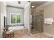 Main bathroom features a soaking tub, a walk-in shower, and tile flooring at 320 Wisteria Cir, Roswell, GA 30076