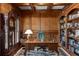 Wood-paneled office features a vintage desk, a grandfather clock, and custom bookshelves at 320 Wisteria Cir, Roswell, GA 30076
