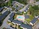 An aerial view of the community's multiple buildings, parking, landscaping, and a central pool and lounge area at 3301 Henderson Mill Rd # D3, Atlanta, GA 30341