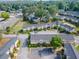 Aerial view of neighborhood featuring townhomes, mature trees, a walking area and lawns at 3301 Henderson Mill Rd # D3, Atlanta, GA 30341