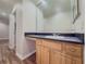 Bathroom featuring vanity with light wood cabinets, a sink, and an adjacent doorway at 3301 Henderson Mill Rd # D3, Atlanta, GA 30341