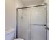 Bathroom featuring a sliding glass door shower and a white toilet at 3301 Henderson Mill Rd # D3, Atlanta, GA 30341