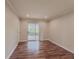 Bedroom featuring wood-look flooring, recessed lighting and access to balcony at 3301 Henderson Mill Rd # D3, Atlanta, GA 30341