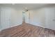 Neutral bedroom featuring wood-look flooring, multiple closets and ample space at 3301 Henderson Mill Rd # D3, Atlanta, GA 30341