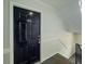 Black door leading to apartment features a sleek design and staircase at 3301 Henderson Mill Rd # D3, Atlanta, GA 30341