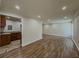 Spacious living room with sleek flooring leading to kitchen and neutral walls at 3301 Henderson Mill Rd # D3, Atlanta, GA 30341