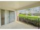 Covered patio with black metal railing offering views of landscaped grounds and nearby homes at 3301 Henderson Mill Rd # D3, Atlanta, GA 30341
