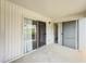 Covered porch with white siding and sliding glass doors with screens at 3301 Henderson Mill Rd # D3, Atlanta, GA 30341