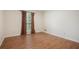 This bedroom boasts new wood flooring and natural light through a large window at 4066 Brymond Ct, Tucker, GA 30084