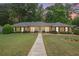 Charming one-story brick home with a well-manicured lawn and inviting walkway at 4066 Brymond Ct, Tucker, GA 30084