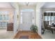 Bright foyer featuring hardwood floors, classic architectural details, and a traditional design at 4066 Brymond Ct, Tucker, GA 30084