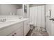 Bathroom featuring a double vanity with white countertops, a large mirror, and a shower at 108 Berwick Crossing, Dallas, GA 30157
