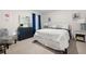 Inviting bedroom featuring a comfortable bed, stylish decor, a dresser, and a cozy chair at 108 Berwick Crossing, Dallas, GA 30157