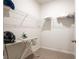 Functional closet space featuring wire shelving and an ironing board with an iron at 108 Berwick Crossing, Dallas, GA 30157