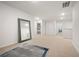 Wide hallway area featuring carpet, a large mirror, and doorways leading to other rooms at 108 Berwick Crossing, Dallas, GA 30157
